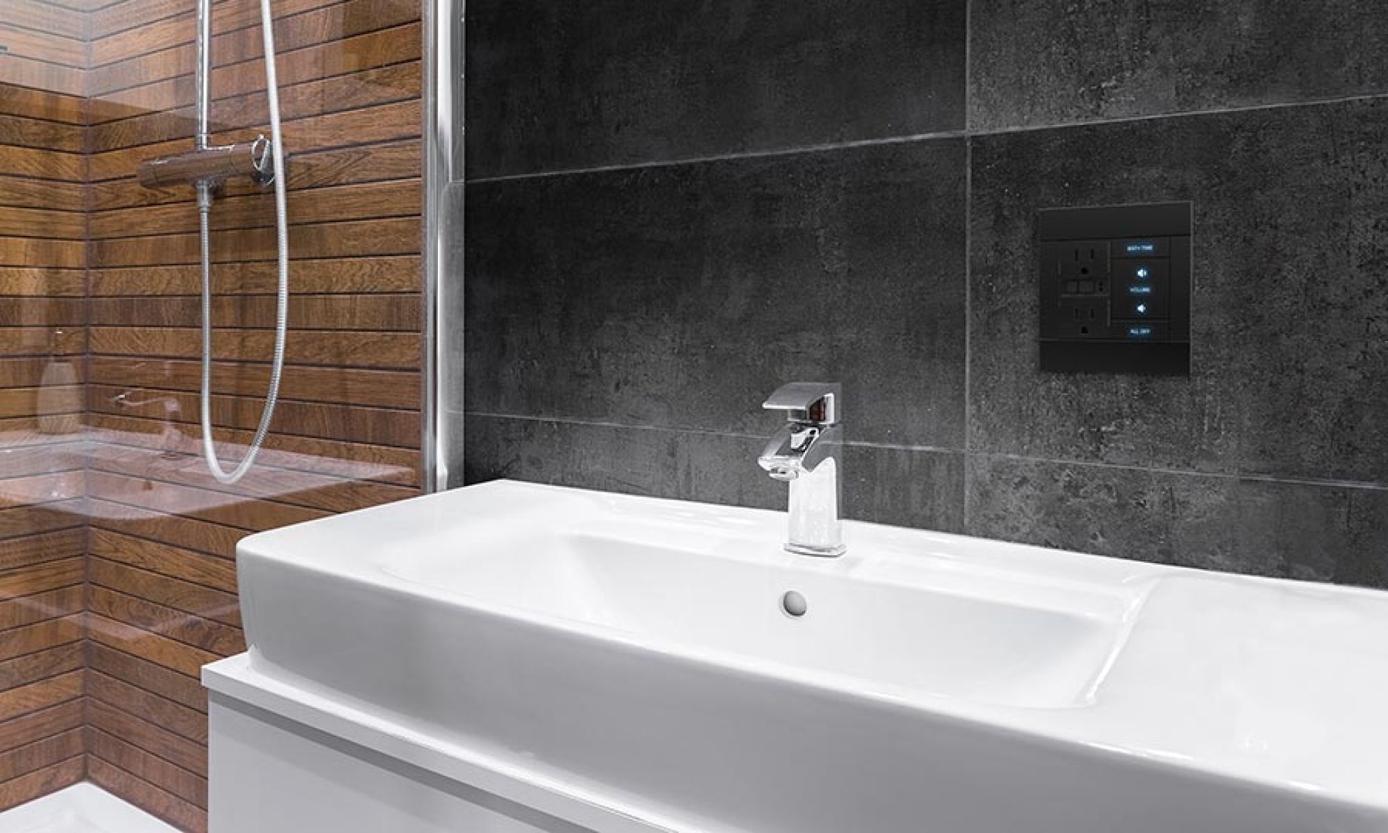 A modern bathroom with a sleek touch-enabled wall control panel and elegant fixtures.